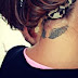 TINY WING TATTOO ON BACK NECK