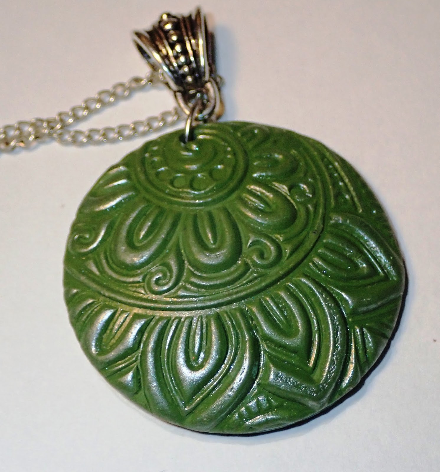 Polymer clay necklace using stamps and embossing folder