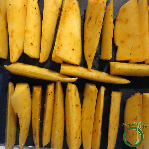Morsels of Life - Sriracha Potato Wedges Step 3 - Place potato wedges skin side down on a baking tray, and bake at 375 for 40 minutes. Placing the potato wedges skin side down saves you the extra step of coming back half way through baking to flip the wedges!