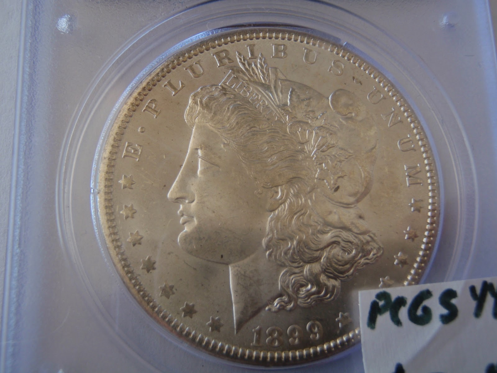 Gold And Silver Coins: 1899-O Morgan Silver Dollar MS-63 / $70