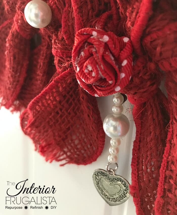 How to make a simple heart-shaped rag wreath for Valentine's Day with red burlap ribbon for a budget-friendly handmade Valentine door wreath idea.