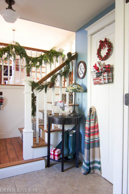 Fresh garland used to decorate entryway in split level home for Christmas