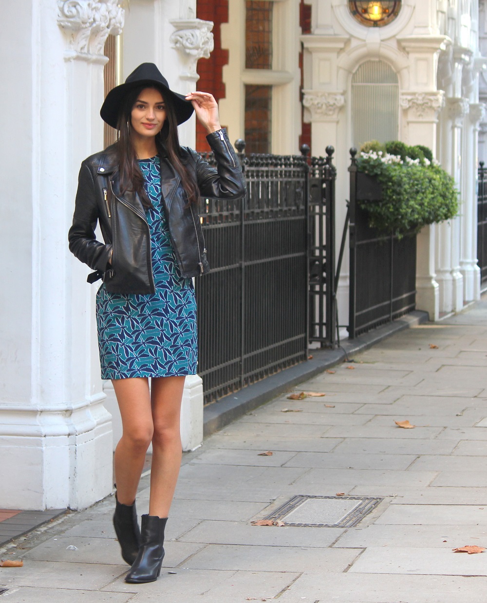 peexo fashion blogger wearing leather jacket and sugarhill boutique dress