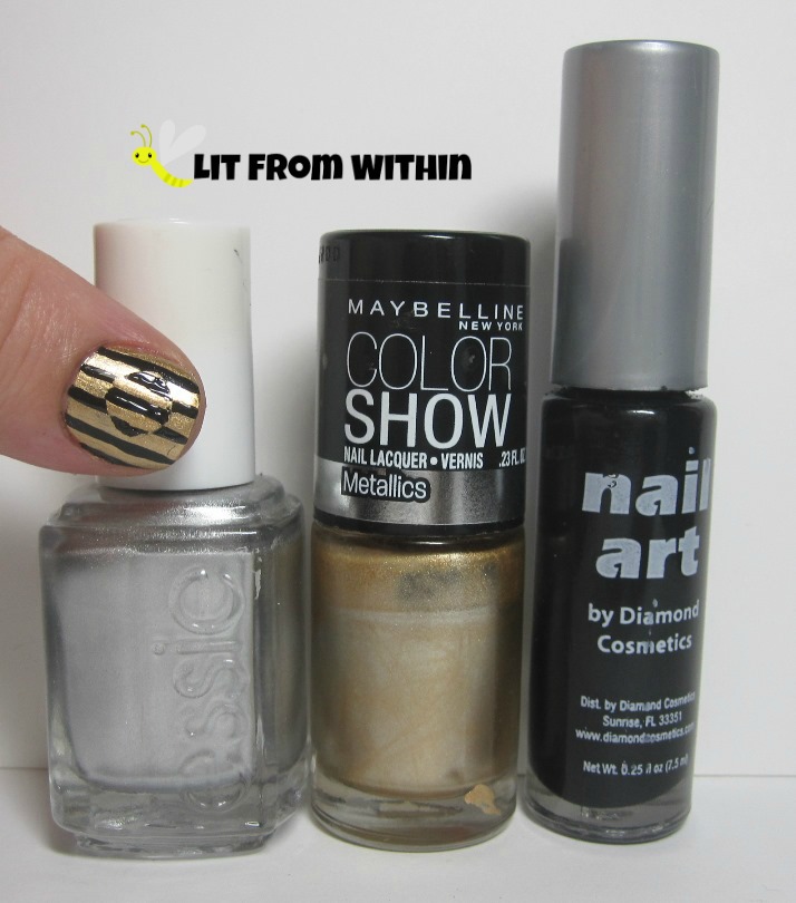 Bottle shot:  Essie No Place Like Chrome, Maybelline Bold Gold, black nail art striper