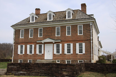Front view of Hope Lodge showing symmetrical arrangement of windows on brick facade