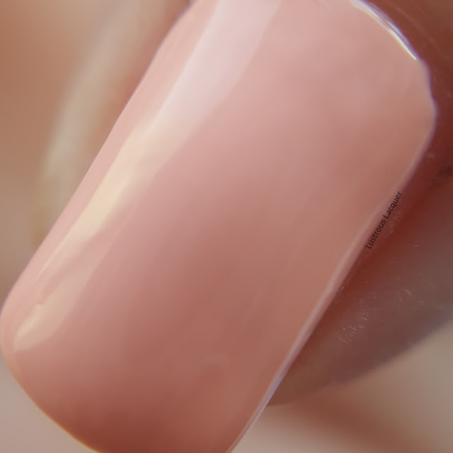 Pale peach nail polish with a pink undertone and a creme finish from the Pastel City Collection