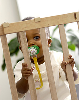 Child behind baby gate Child behind baby gate