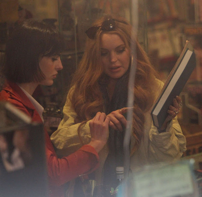 Lindsay Lohan checking out a book in a  Vintage Shop in Brooklyn