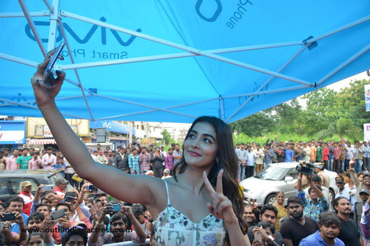 Pooja Hegde at Lot Mobile Store in Vijayawada