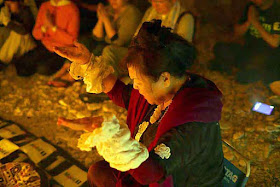 Rituals and prayer in a cave, Ayako Toguchi, priestess