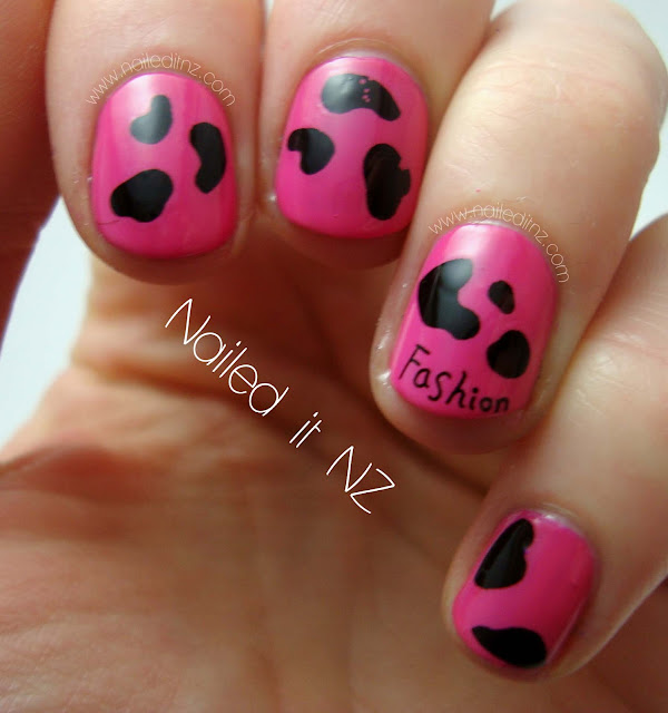 Pink and black cow print nails with a twist!