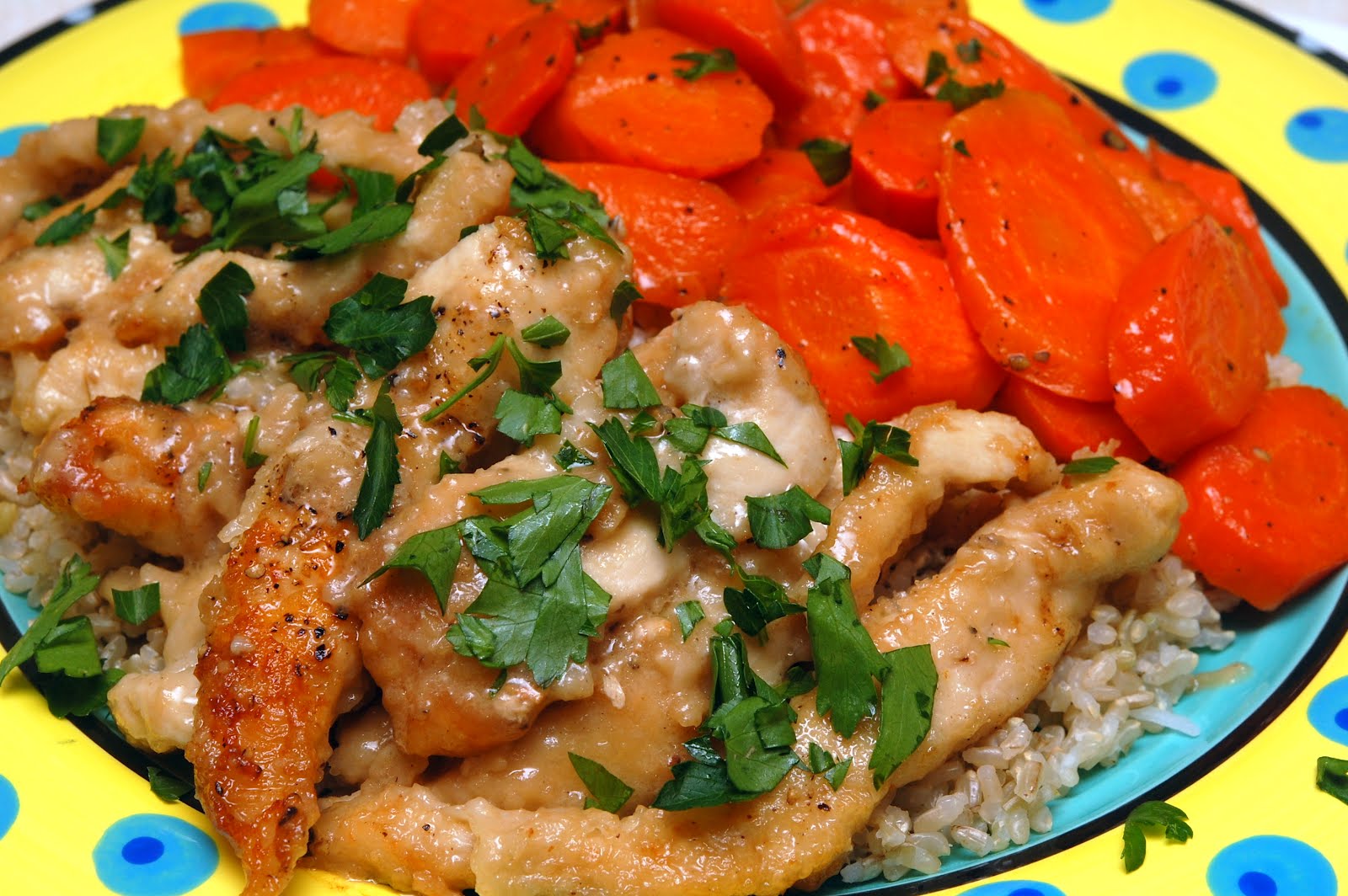 CHICKEN STRIPS IN A COGNAC CREAM SAUCE WITH GLAZED CARROTS OVER BROWN