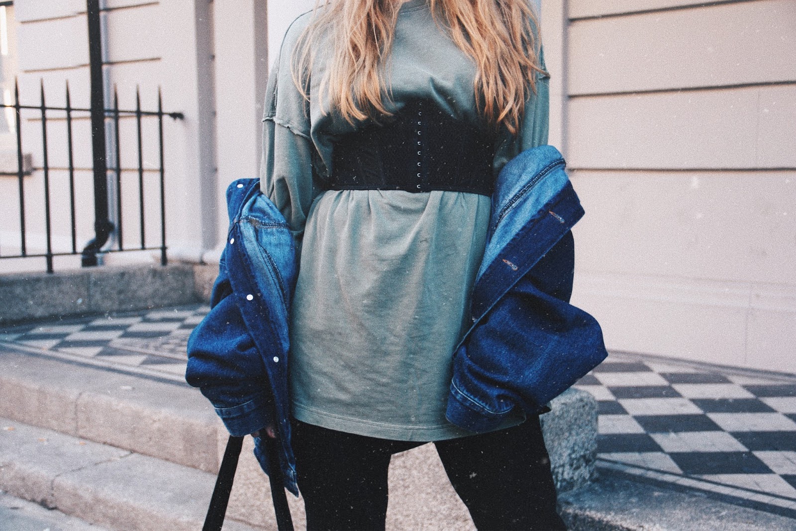 jacket hanging off shoulder