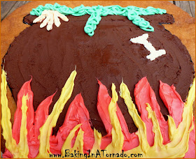 Witch's Caldron Giant Cookie: A giant cookie decorated with chocolate and white frosting for delicious Halloween fun | Recipe developed by www.BakingInATornado.com | #recipe #Halloween