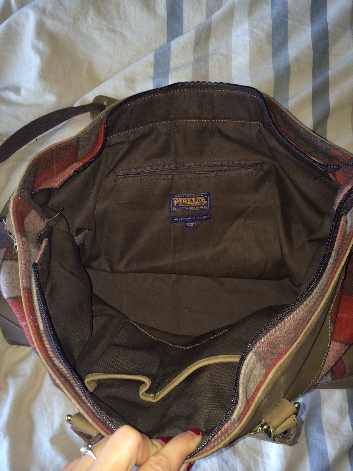 laws of general economy Pendleton "Portland Collection" luggage bag