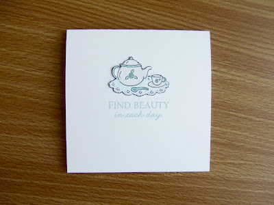 “Find Beauty in Each Day” in Celadon, with a teapot, teacup, and doily colored in pale aquas.