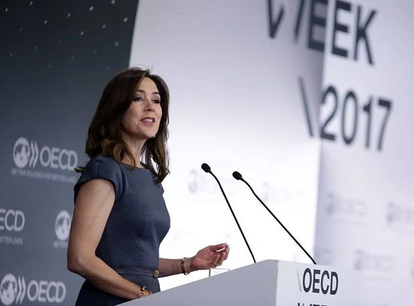 Crown Princess Mary attended the opening of OECD forum at Oecd Conference Centre in Paris. wore Prada dress Gold earrings