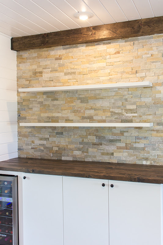Stacked Stone Kitchen with Floating Shelves
