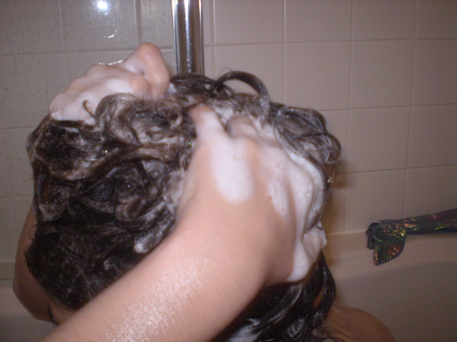 child washing their hair