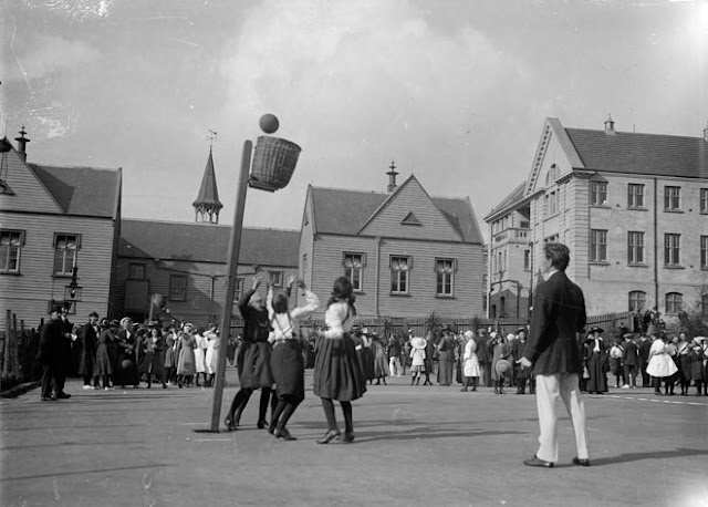 Girls basketball 1910. Woven basket attached to pole. Baskets and Ladders. marchmatron.com Girls basketball 1910. Woven basket attached to pole. Baskets and Ladders. marchmatron.com