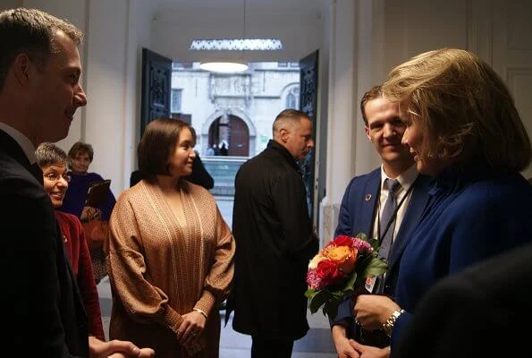 Queen Mathilde wore a new Natan dress and the queen wore a new blu jacket by Natan. United Nations Sustainable Development Goals