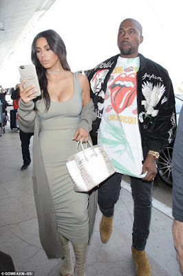 1a3 Kim Kardashian puts her curvy body on display as she hits the airport with hubby