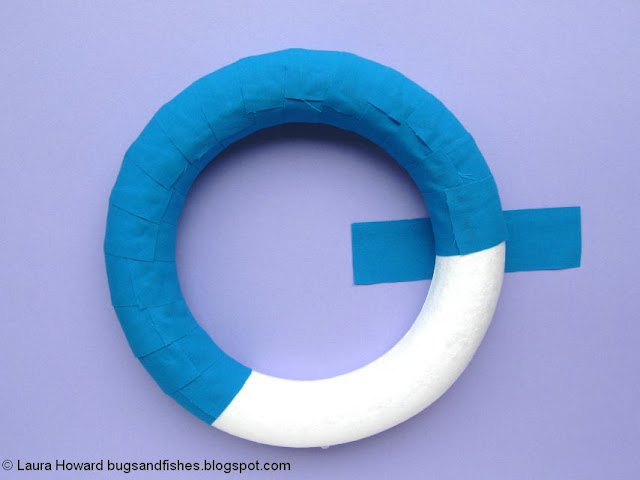 DIY Felt Pinwheels Summer Wreath Tutorial wrapping the wreath base with fabric strips