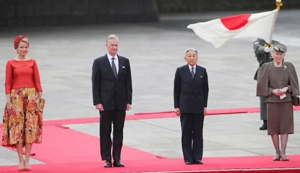 Belgian King Philippe and Queen Mathilde are welcomed by Japanese Emperor Akihito and Empress Michiko upon their arrival at the Imperial Palace. Mathilde Natan Dress
