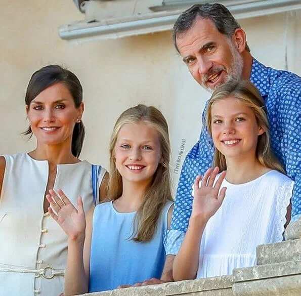 King Felipe, Queen Letizia, Crown Princess Leonor and Infanta Sofia. Queen Letizia wore Mango linen blend midi dress gold buttons