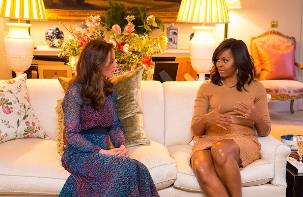 Prince William, Duke of Cambridge speaks with US President Barack Obama as Catherine, Duchess of Cambridge speaks with First Lady of the United States Michelle Obama and Prince Harry in the Drawing Room of Apartment 1A Kensington Palace