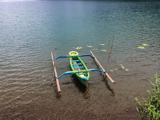 Traditional Paddle Canoe Parked At The Edge Of The Lake Beratan At Bedugul, Tabanan, Bali, Indonesia