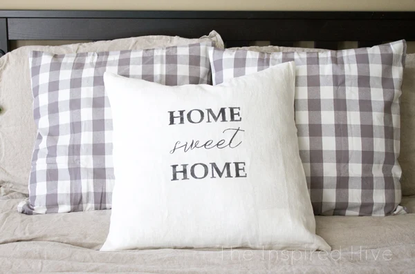 How to use Silhouette to make a DIY stenciled farmhouse style throw pillow.