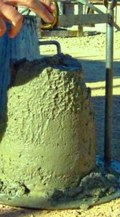 Measuring slump of fresh concrete during batching 