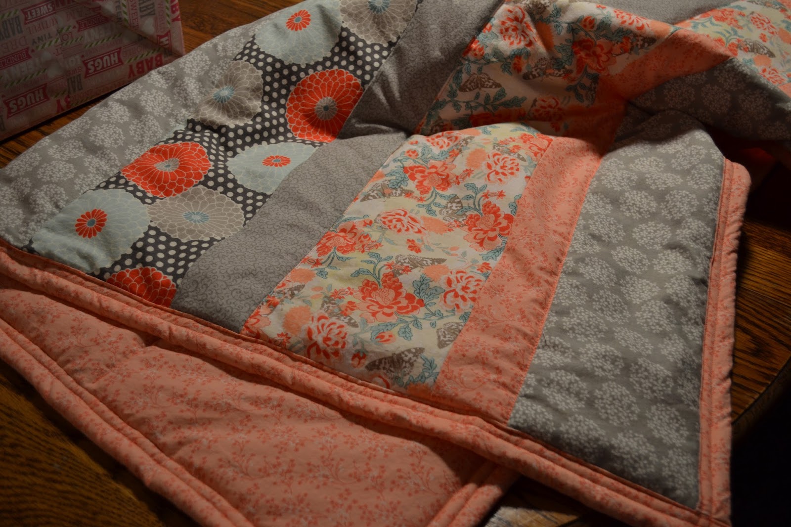 Quantrell Quips Wrap Them in Love Making Baby Quilts