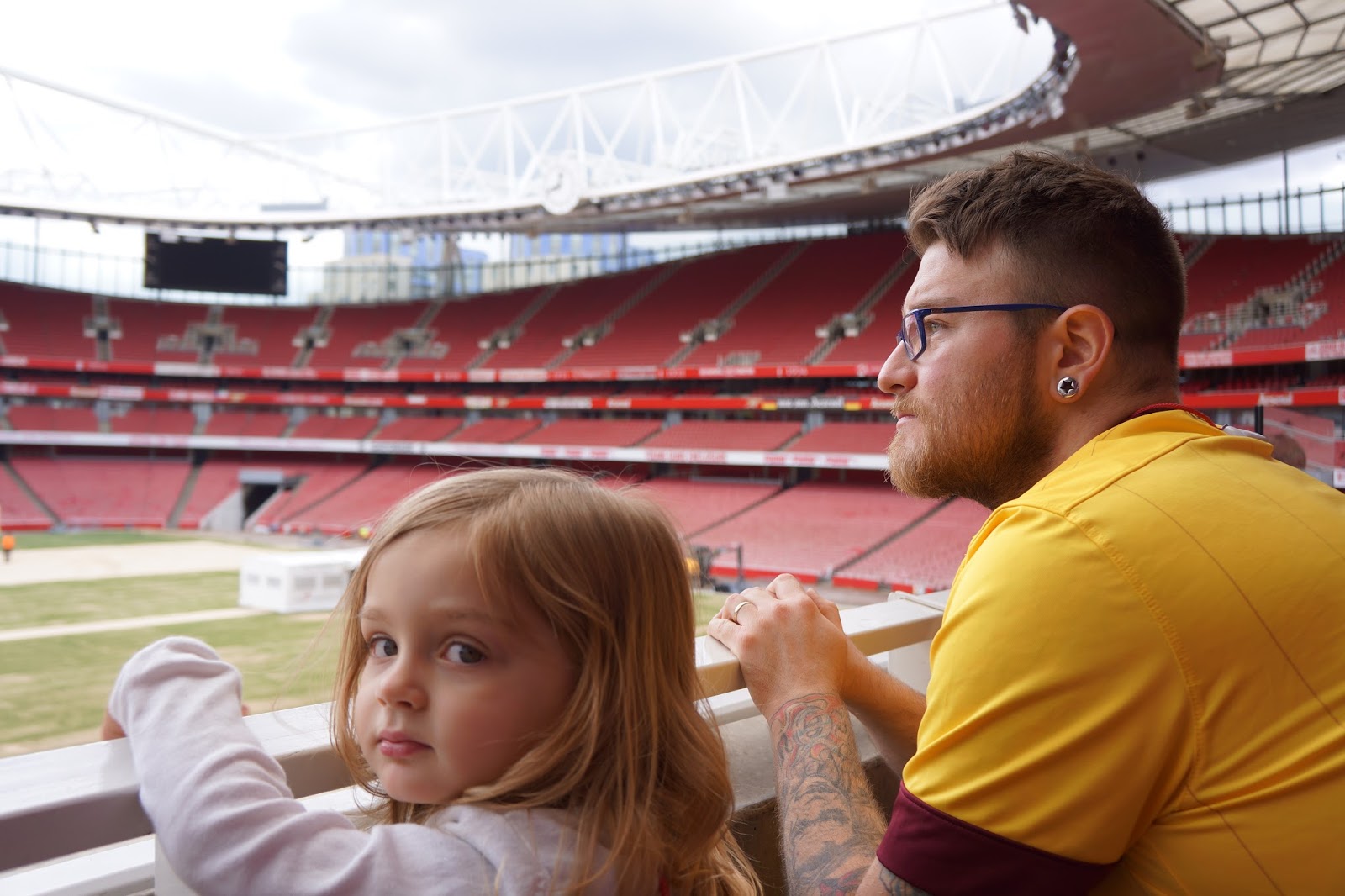 dad and daughter at arsenal stadium