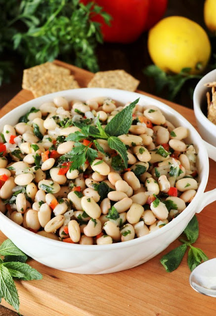 Flavor-packed Lemony White Bean Salad with fresh mint, parsley, lemon juice and zest.