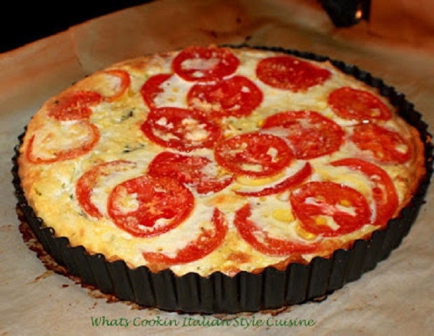 this is a pastry crust tart like quiche filled and baked with mozzarella cheese, zucchini shredded and sliced tomatoes in a rich egg filling into the crust and baked