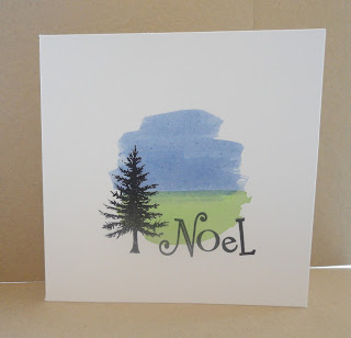 Messy inky circle with black tree and Noel