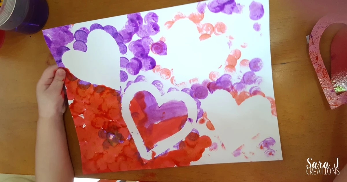 This is an idea for a Valentine's Day heart craft for kids that is so easy yet so so cute and colorful.  