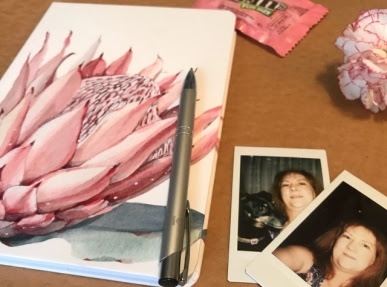 Journal to coumnt my blessings Flatlay of Journal with Instax selfie photos