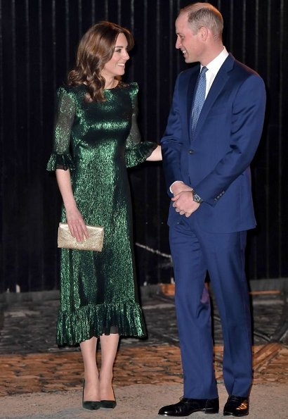 Kate Middleton wore The Vampire's Wife Falconetti emerald midi dress, Brora gold charm earrings. Meghan Markle