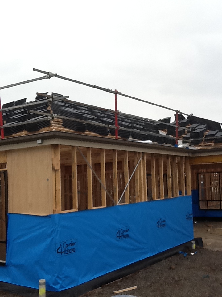 Any Day Now Tiles delivered, and roofing begins