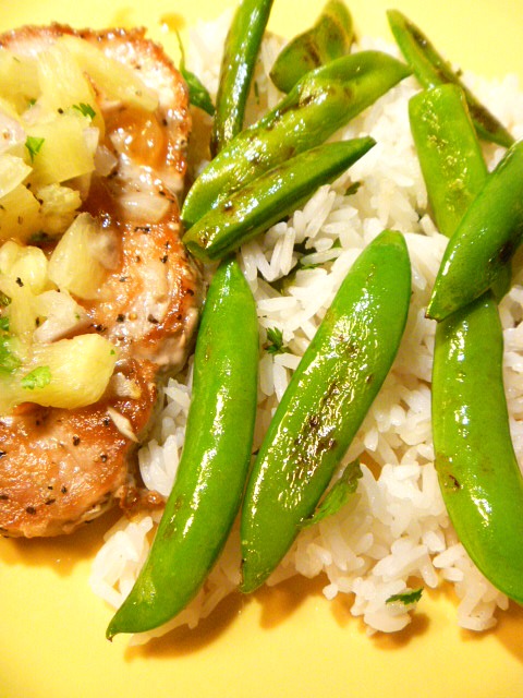 A light and tropical flavored dish of Pineapple Pork Chops with Snap Peas and Jasmine Rice.  Perfect for a summer weeknight meal. - Slice of Southern
