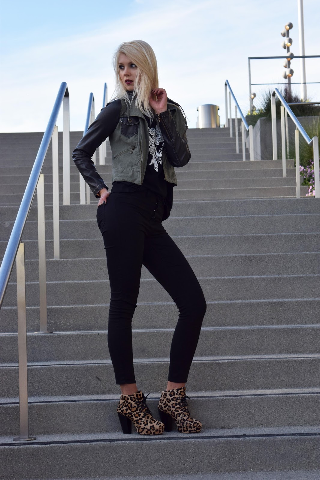 high waisted jeans, black, army inspired jacket, jacket, leopard boots.