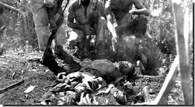 Dead Japanese Soldier Surrounded by American Soldiers