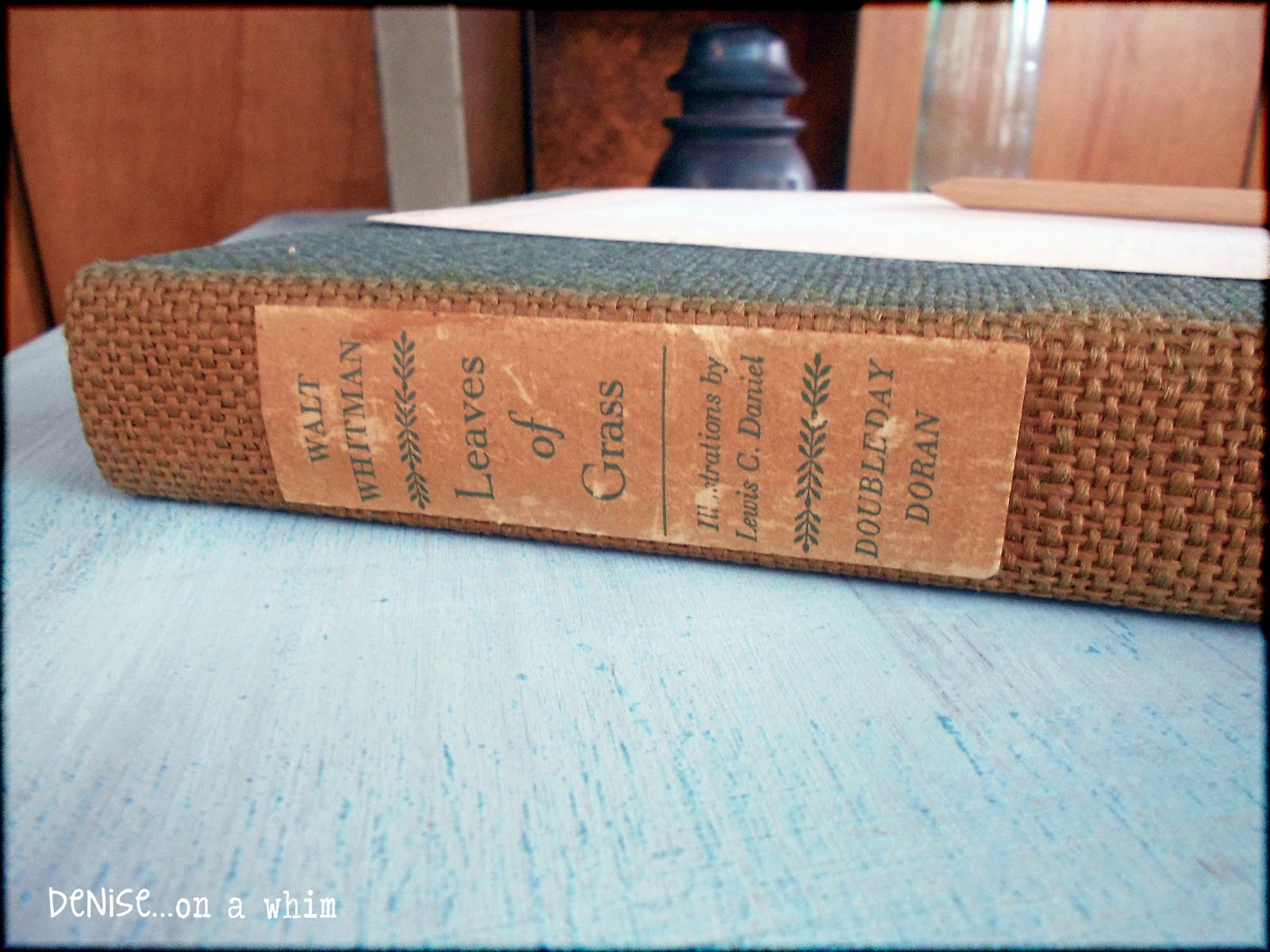 Vintage copy of Leaves of Grass with sun-faded binding via http://deniseonawhim.blogspot.com