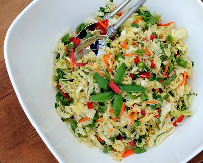 Asian Slaw with sugar snap peas and an Asian dressing. Lots of color and crunch. WW friendly, low carb.