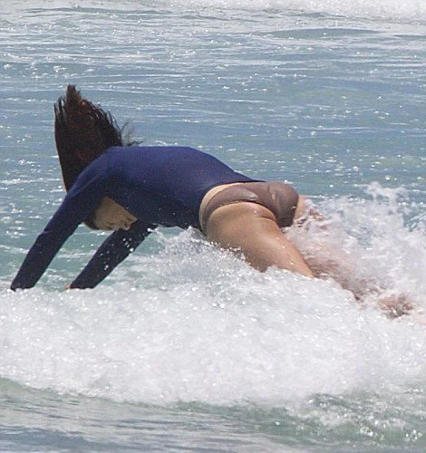 Crown Princess Mary was pictured in the surf with her husband Crown Prince Frederik and their children Prince Christian, Princess Isabella and Princess Josephine.