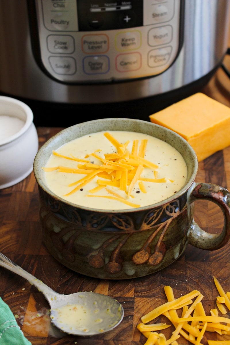 With just a few simple ingredients and the help of your pressure cooker, you can make a creamy, cheesy, restaurant-worthy Broccoli Cheese Soup at home in less than 30 minutes! #instantpot #broccolicheesesoup #souprecipe