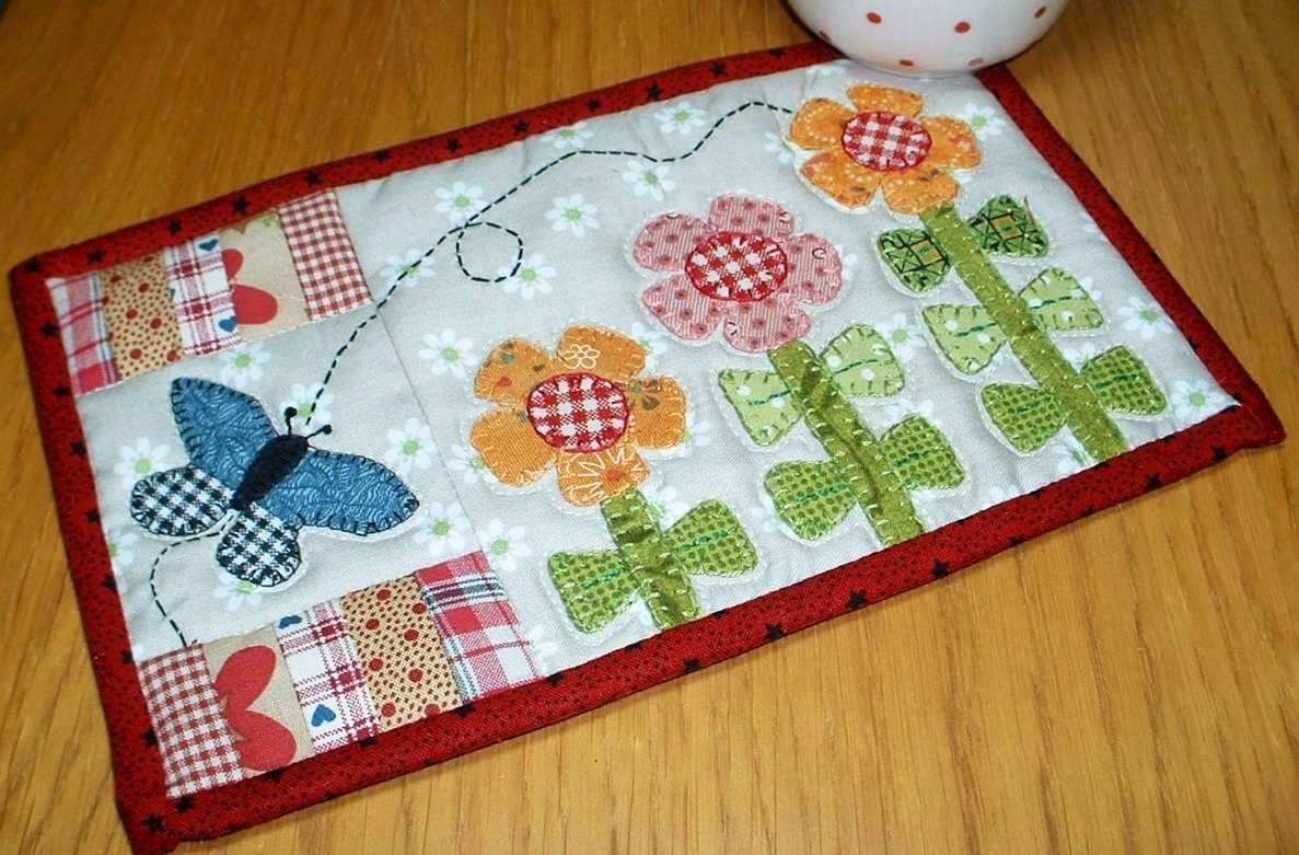 http://www.craftsy.com/pattern/quilting/home-decor/growing-flowers-mug-rug/47635